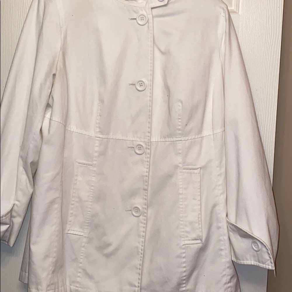 White, lightweight jacket with hood.